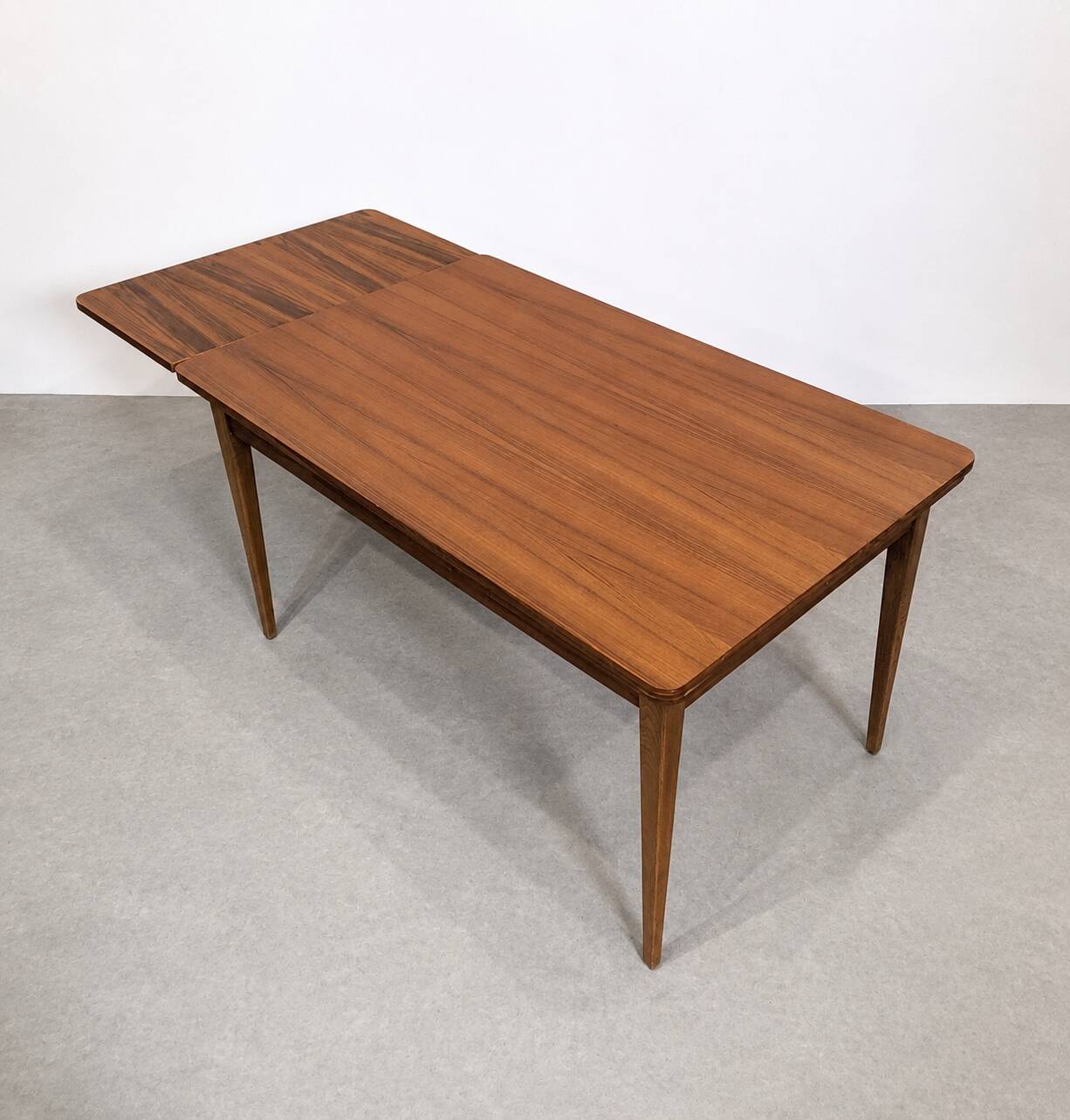 Scandinavian extendable dining table in teak, circa 1960.