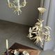 Small vintage cream metal flower chandelier with orange flowers and 3 arms.