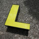 Letter "l" of industrial sign yellow and black