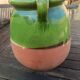 Mediterranean pot in green half-glazed terracotta.