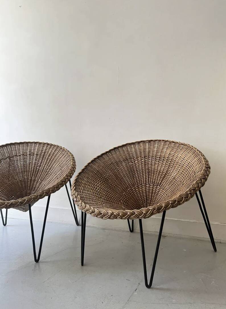 Italian basket chair in rattan and black metal, 1950s design.