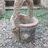 Medicis stone planters with old tree trunk decor