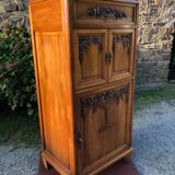 Art Deco sideboard bar cabinet in solid walnut with 3 doors and 1 richly carved tilting false drawer.