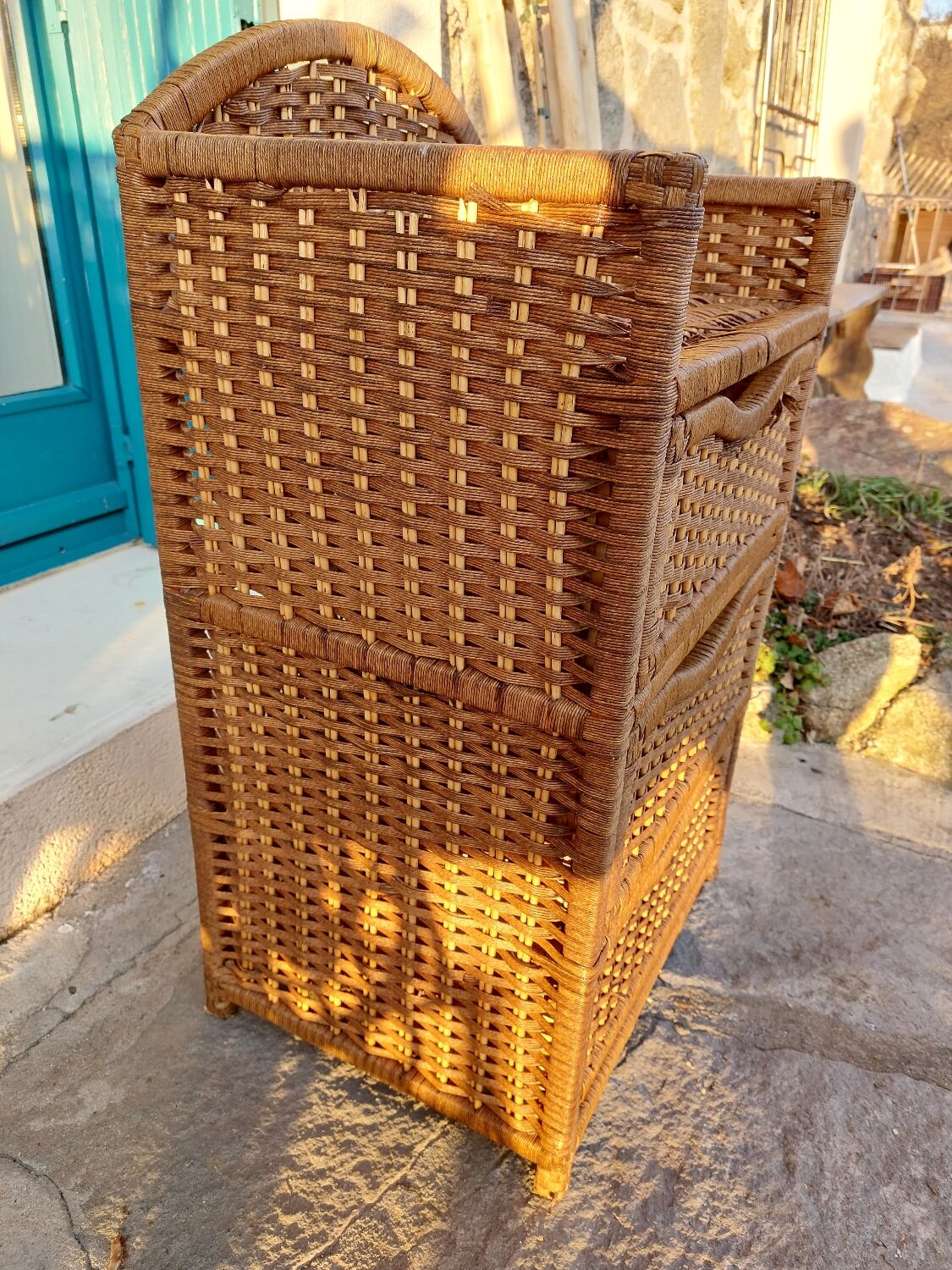 Wicker chest of drawers and rope