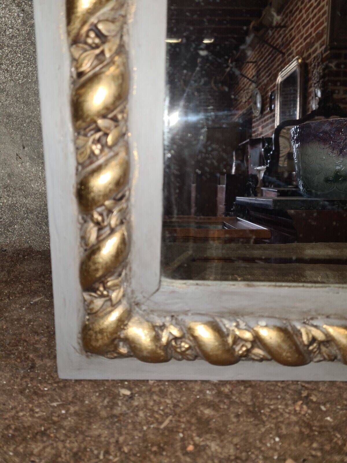 gray and gold patinated trumeau mirror