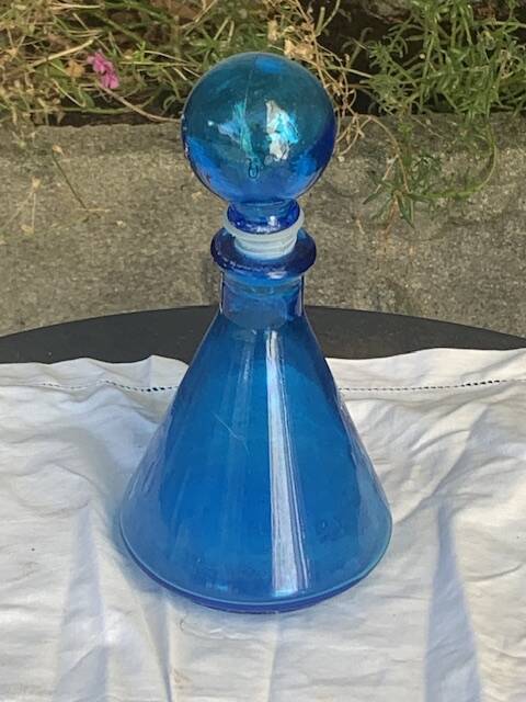 Blue bottle, glass vial for vintage perfume or liqueur.