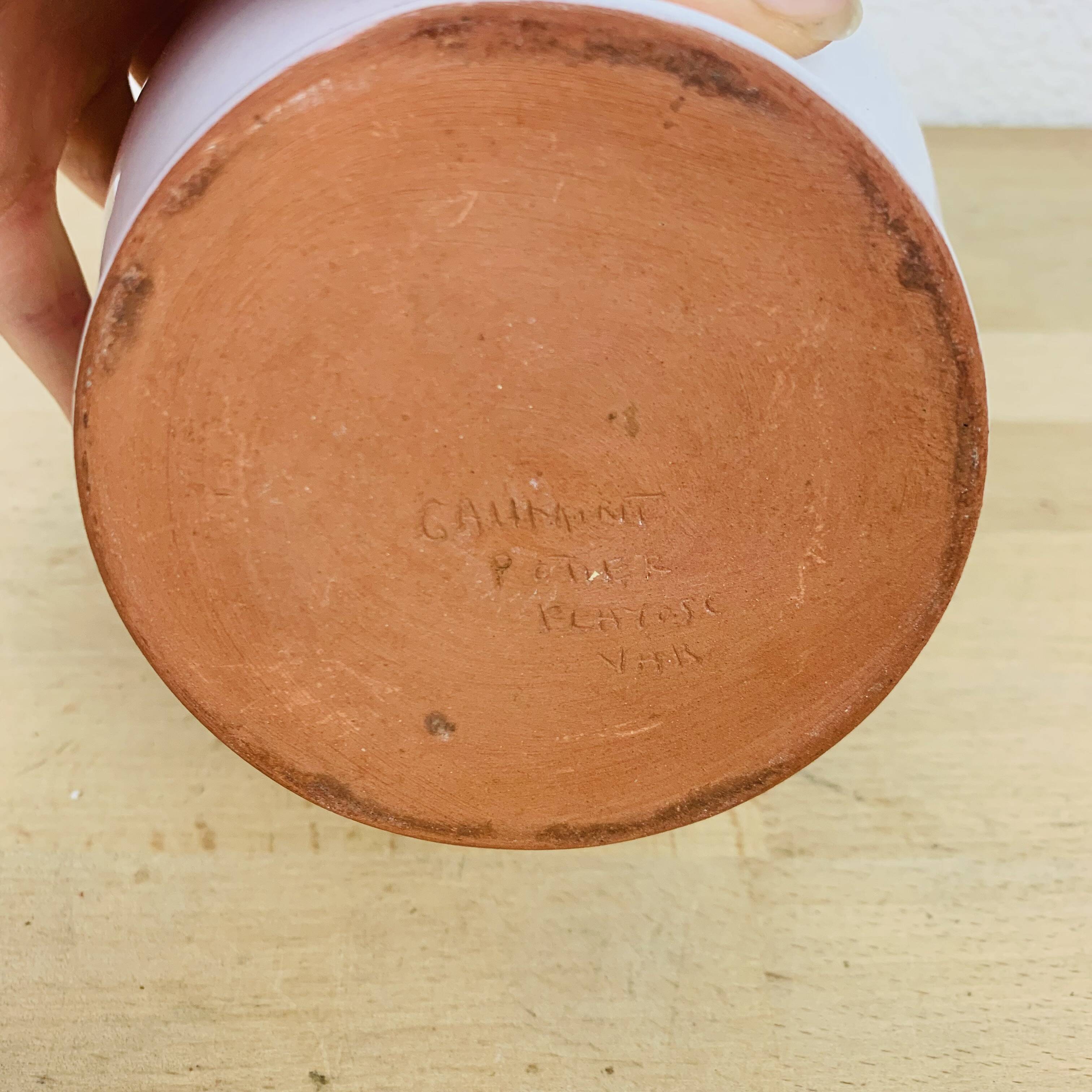 Vase with white ceramic flowers