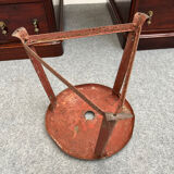 Red tripod industrial metal stool