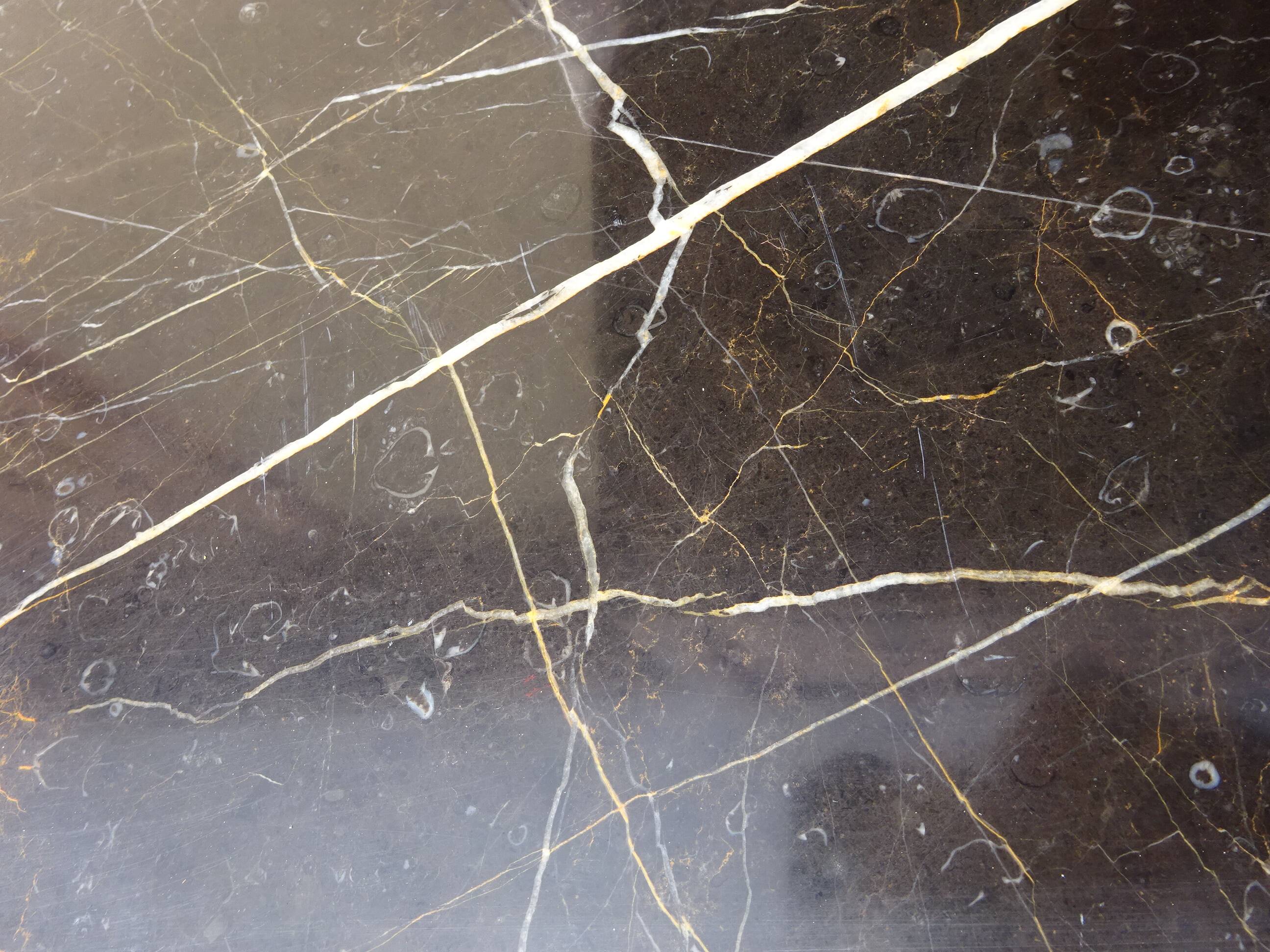 Solid walnut sideboard, moustache legs, black marble top.