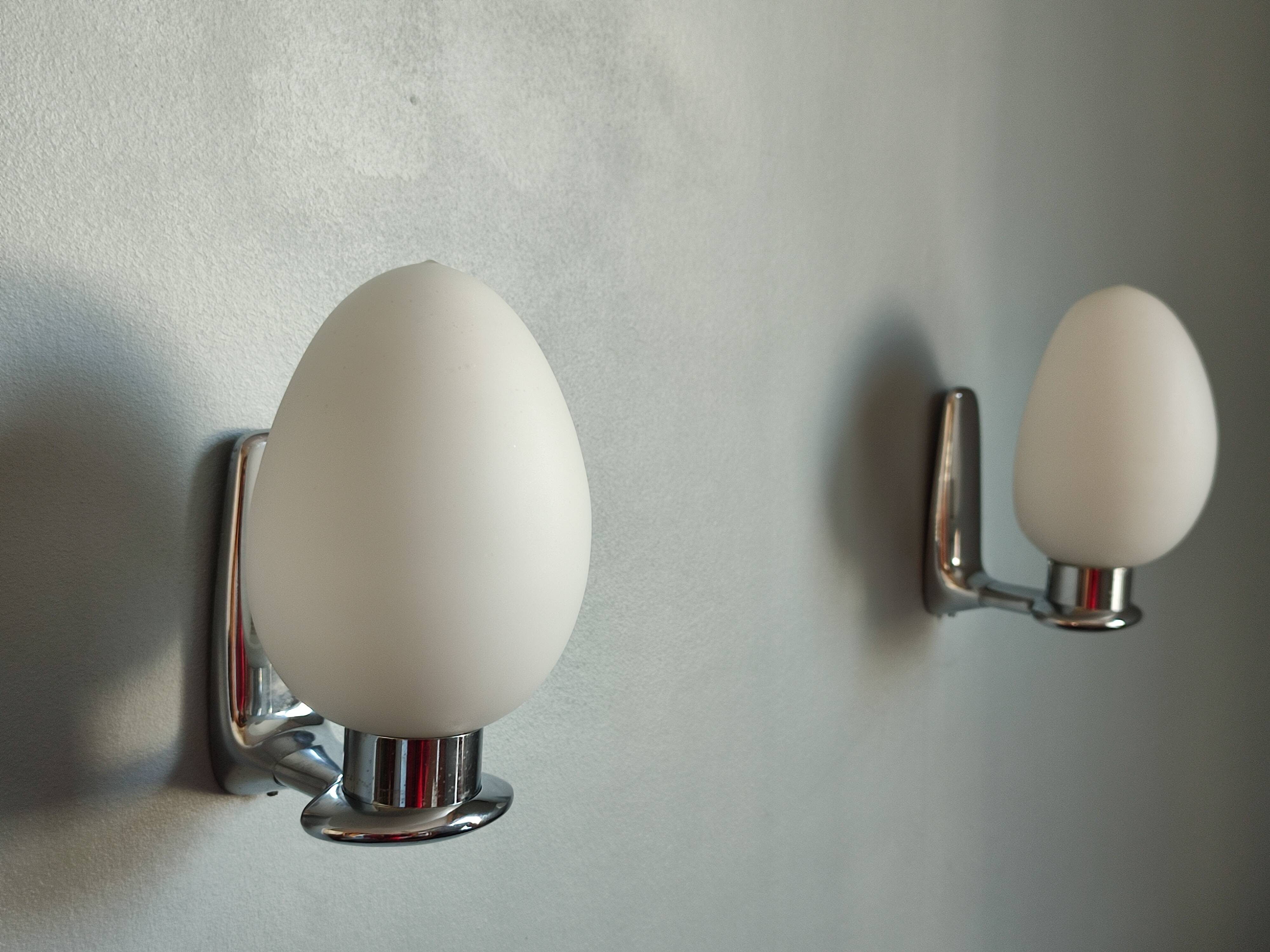 Pair of ouefs sconces in opaline and vintage chromed metal