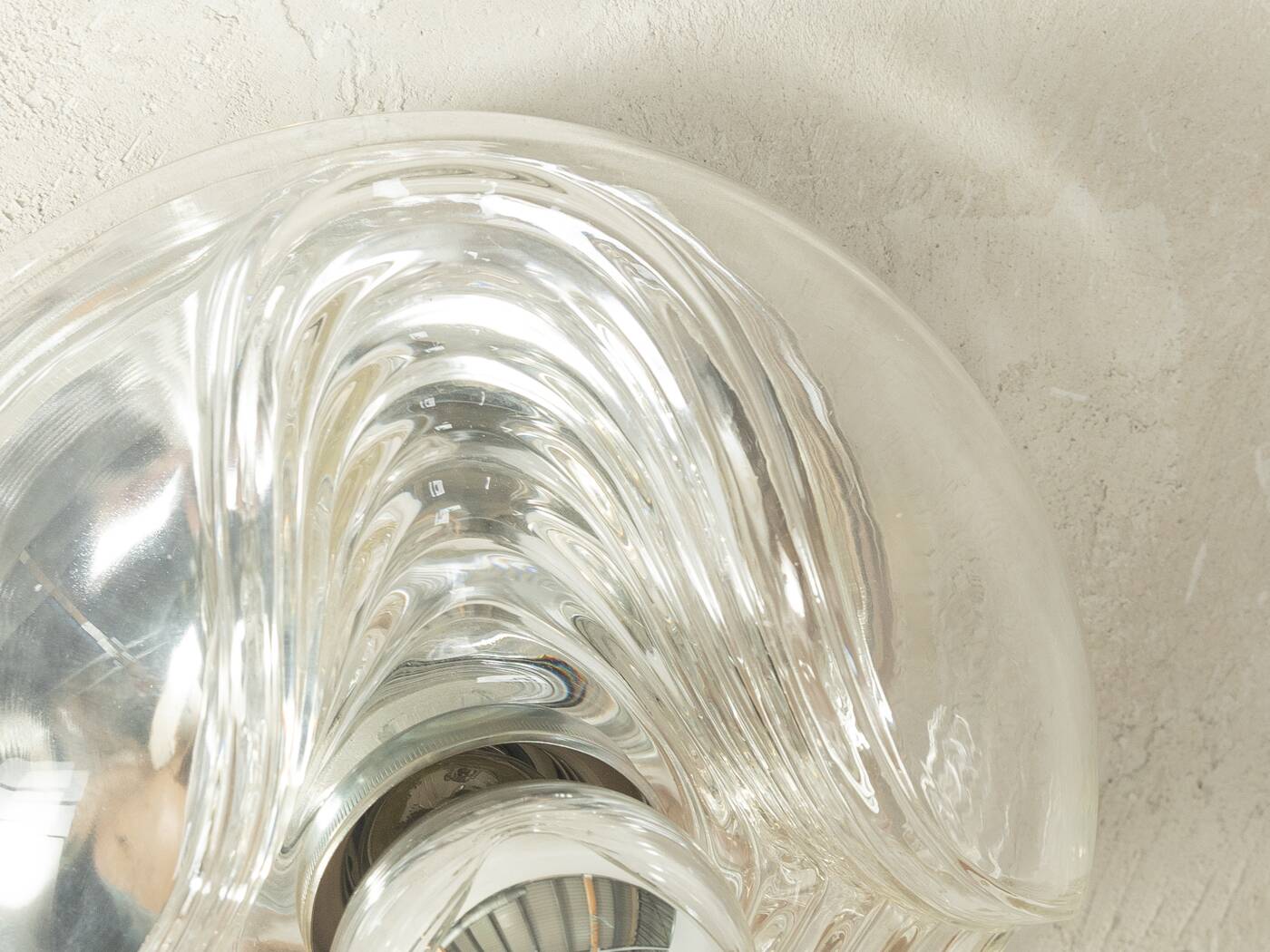 Sculptural wave wall lamp made of structured solid glass by peill & putzler