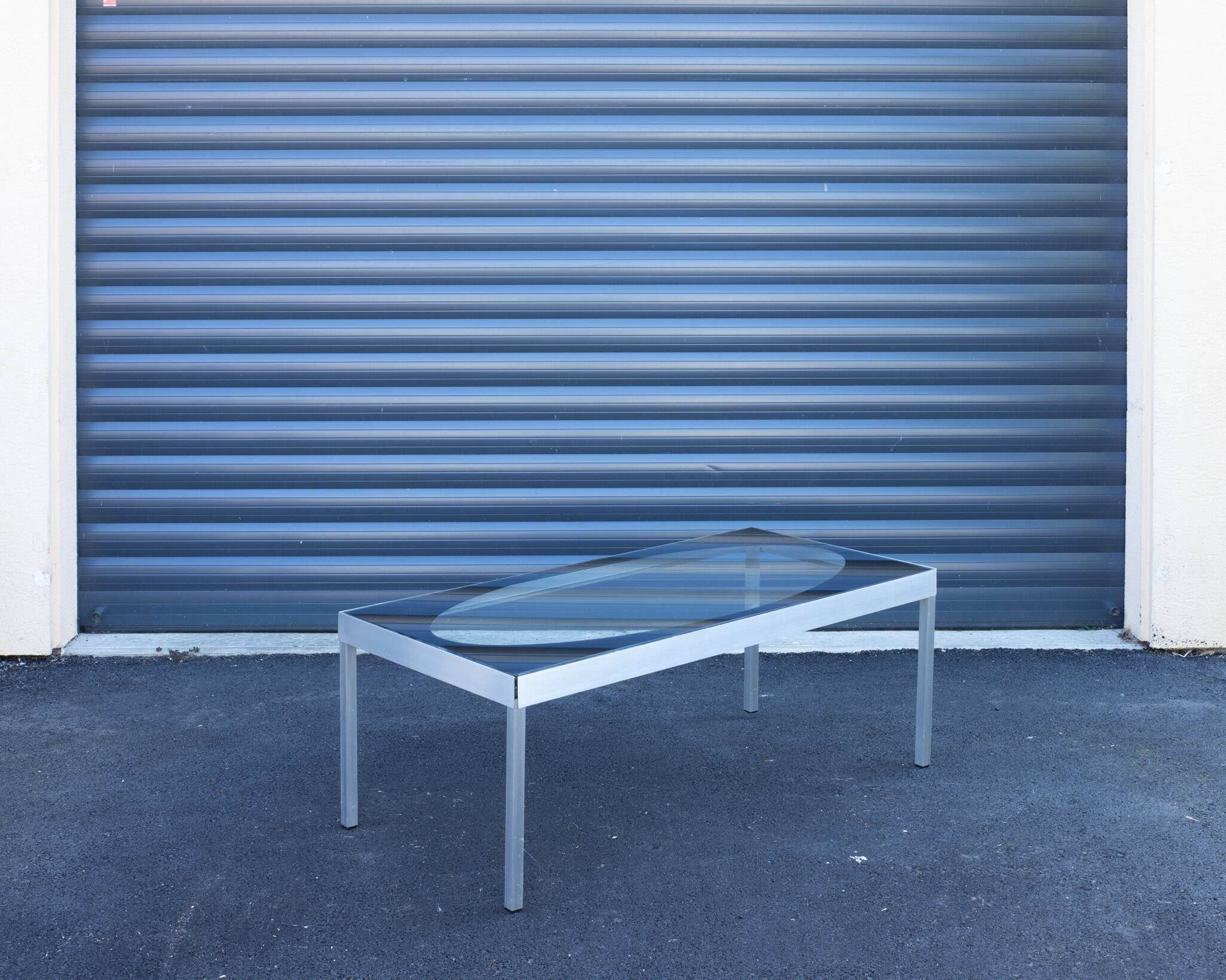 Glass coffee table with brushed aluminum legs, 1970