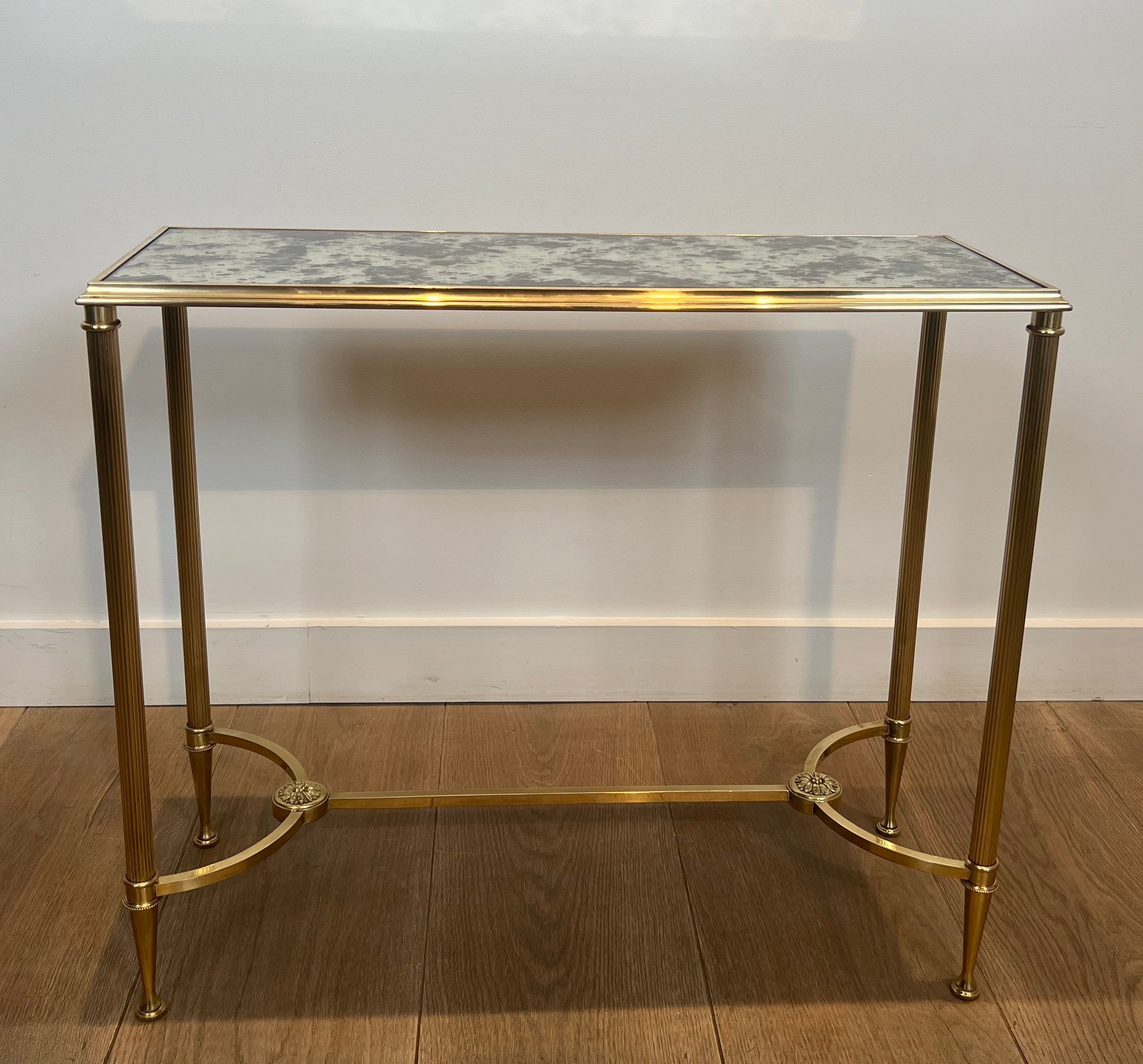 Pair of brass and antique mirror side tables from the Baguès house.