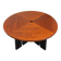 Large round dining table with black blade legs.