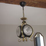 Suspension of years 50-60 in glass and metal