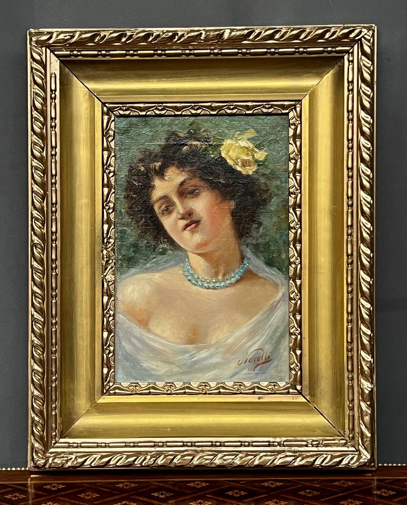 Portrait of a young woman. Signed Nevelli.