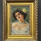Portrait of a young woman. Signed Nevelli.