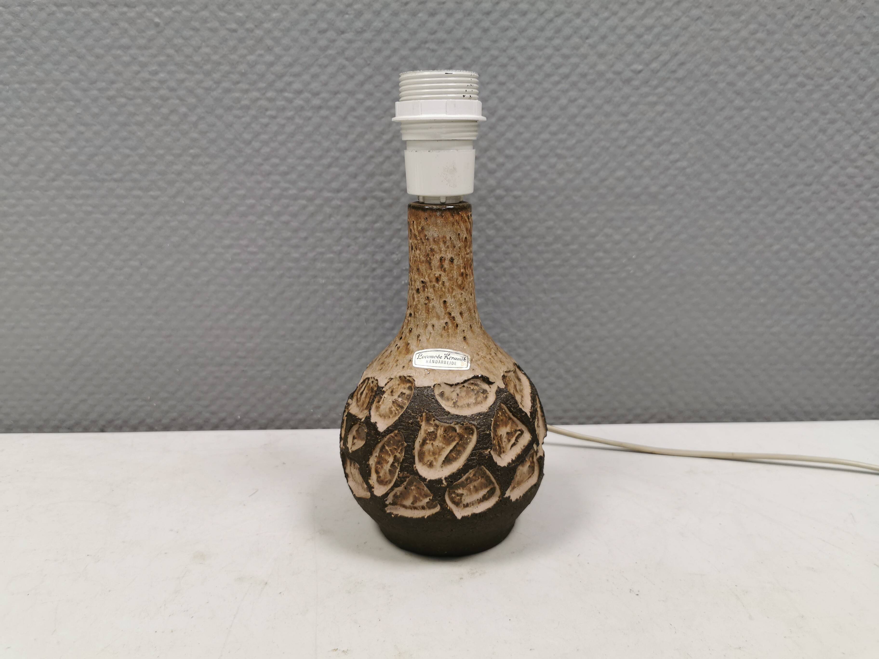 Small beautiful ceramic table lamp in earth colors.