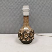 Small beautiful ceramic table lamp in earth colors.