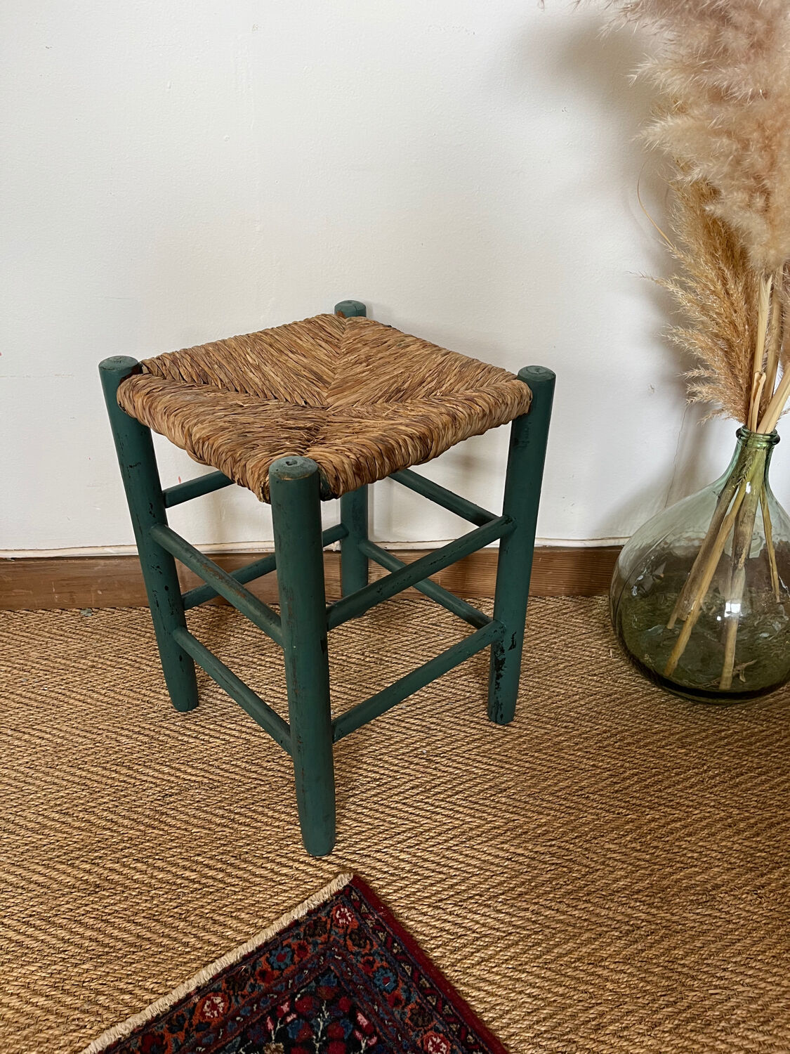 Vintage stool in green patinated wood and straw