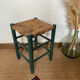 Vintage stool in green patinated wood and straw