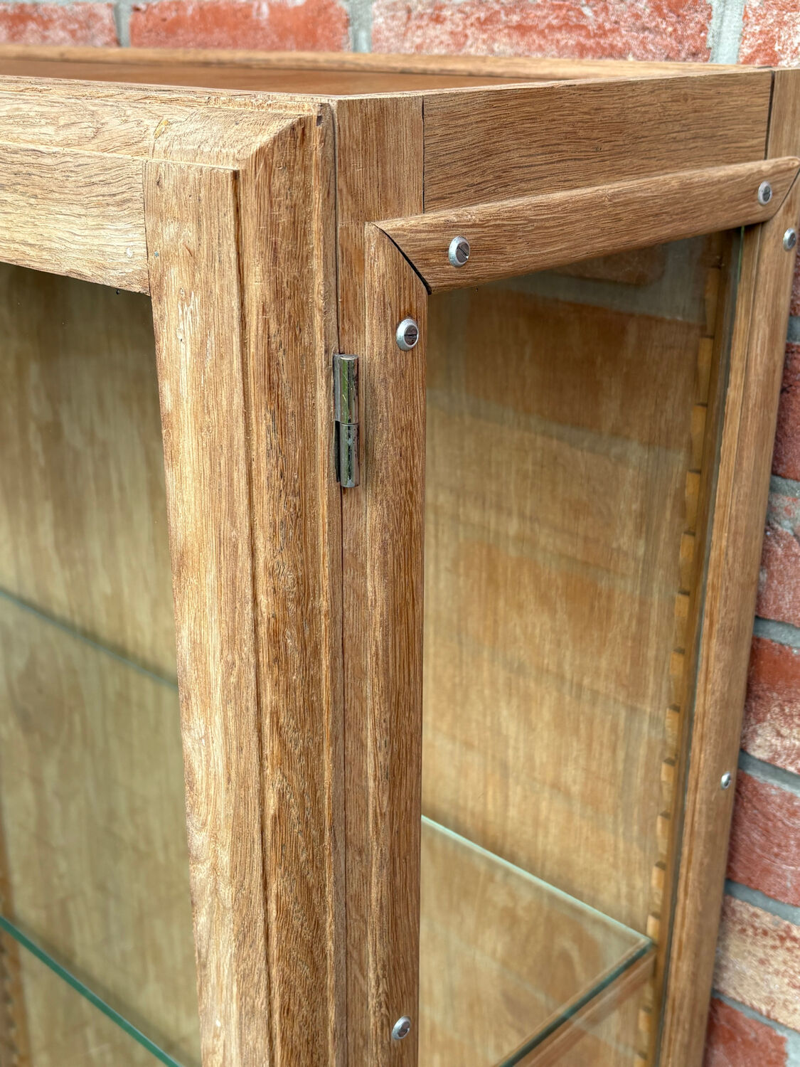 Restored antique oak display cabinet with glass shelves.