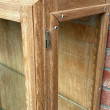 Restored antique oak display cabinet with glass shelves.
