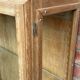 Restored antique oak display cabinet with glass shelves.