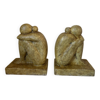 Vintage bookends in patinated cement, sculptures of entwined figures, s