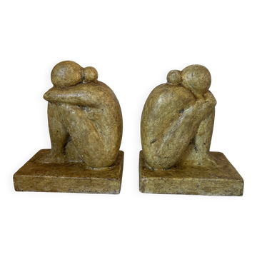 Vintage bookends in patinated cement, sculptures of entwined figures, s