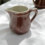 Brown ceramic teapot and milk jugs