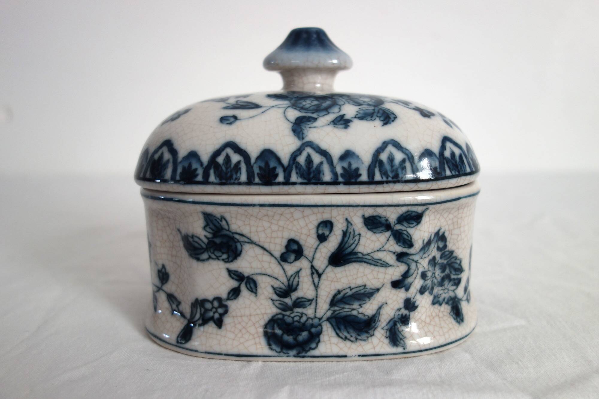 Old porcelain candy box with cracked effect