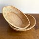 Pair of vintage braided rattan baskets