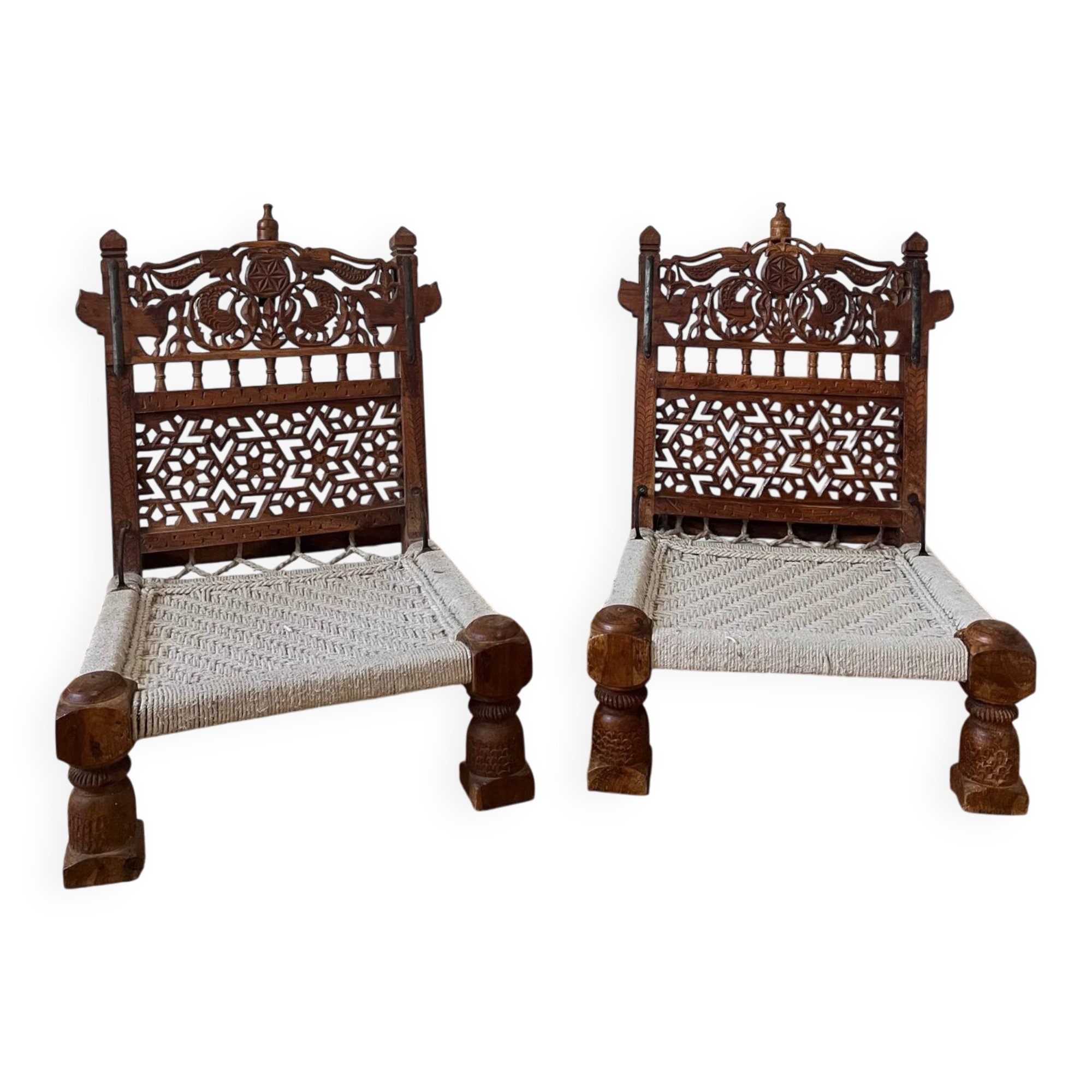 Pair of traditional Indian chairs made of carved wood and rope