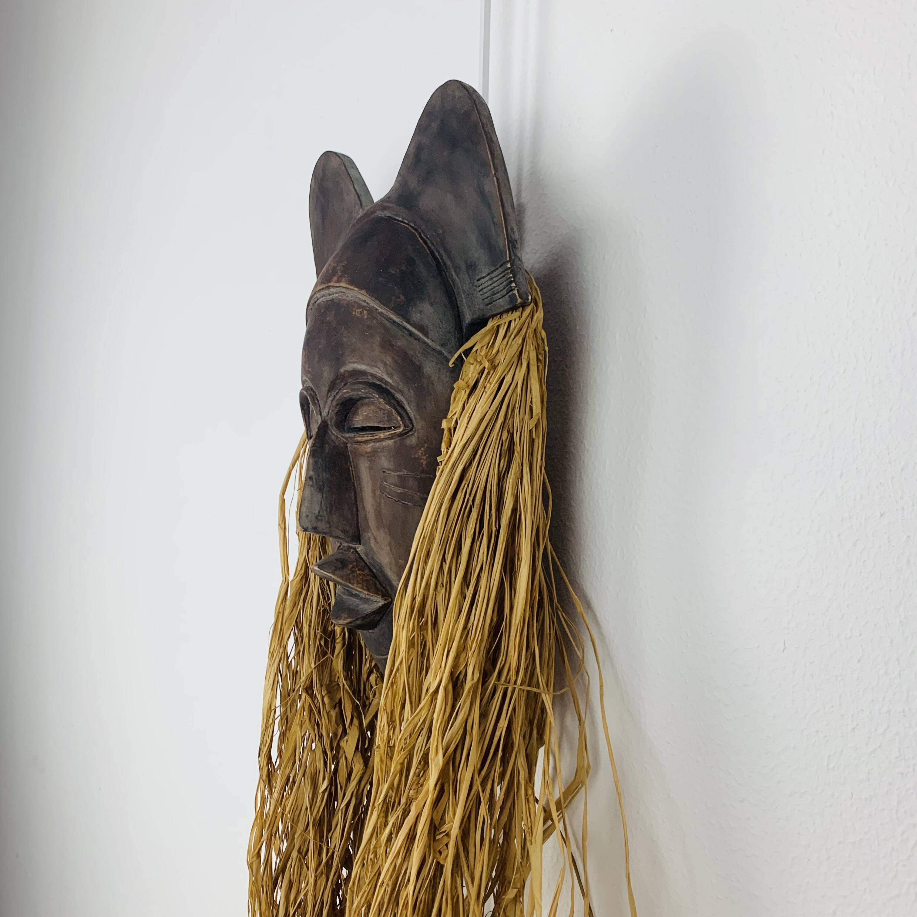 African ceramic and raffia mask signed BJ