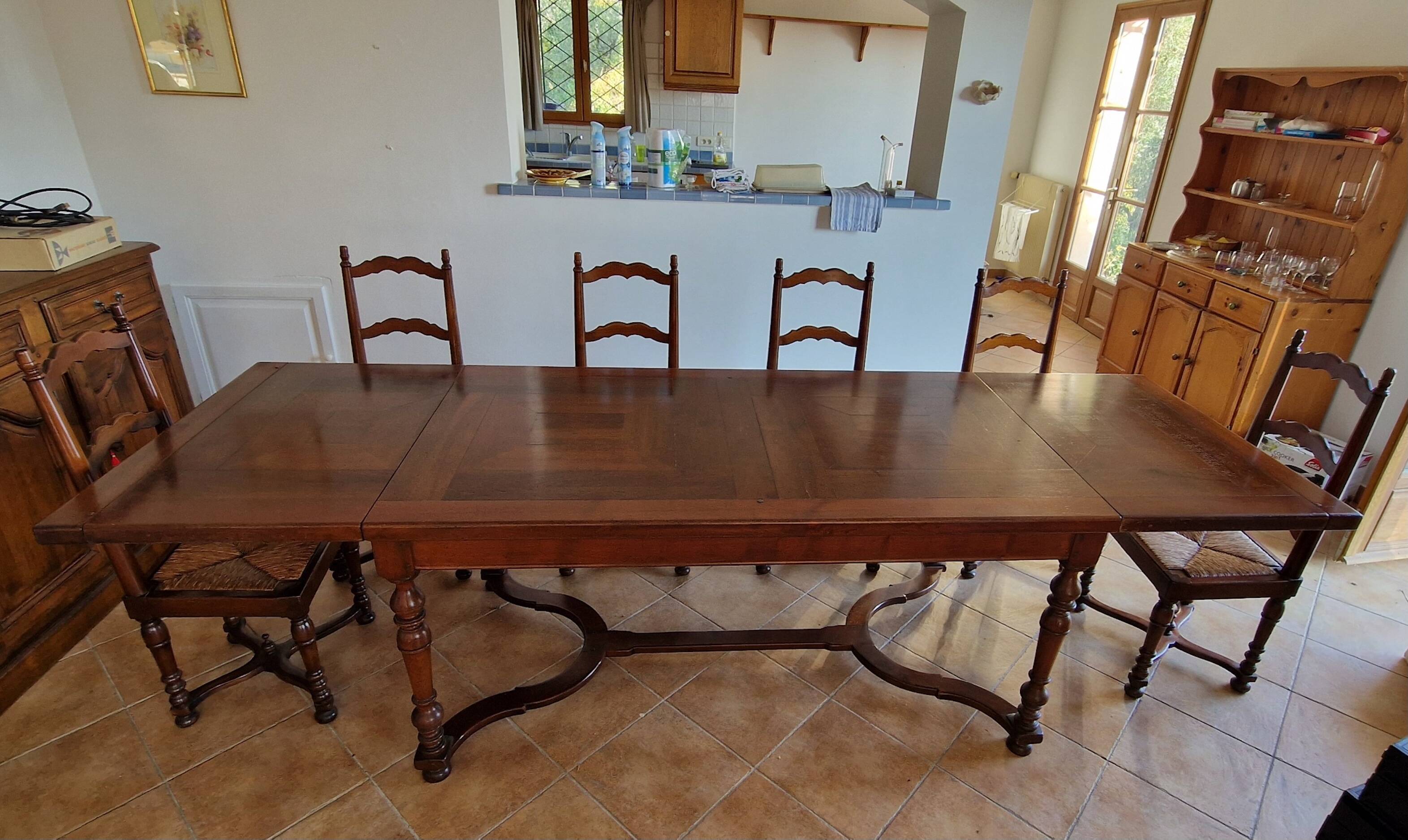 Marquetry wooden dining table with its 6 chairs.