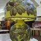 Table lamp in multilayer glass paste, adorned with a rich floral decoration.