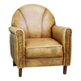 Unique children’s armchair made of cowhide leather in Art Deco style, featuring a light cognac color