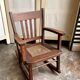 Children's rocking chair in dark wood and cane