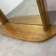 Miroir à tablette cerclage bois, forme ogive, années 60