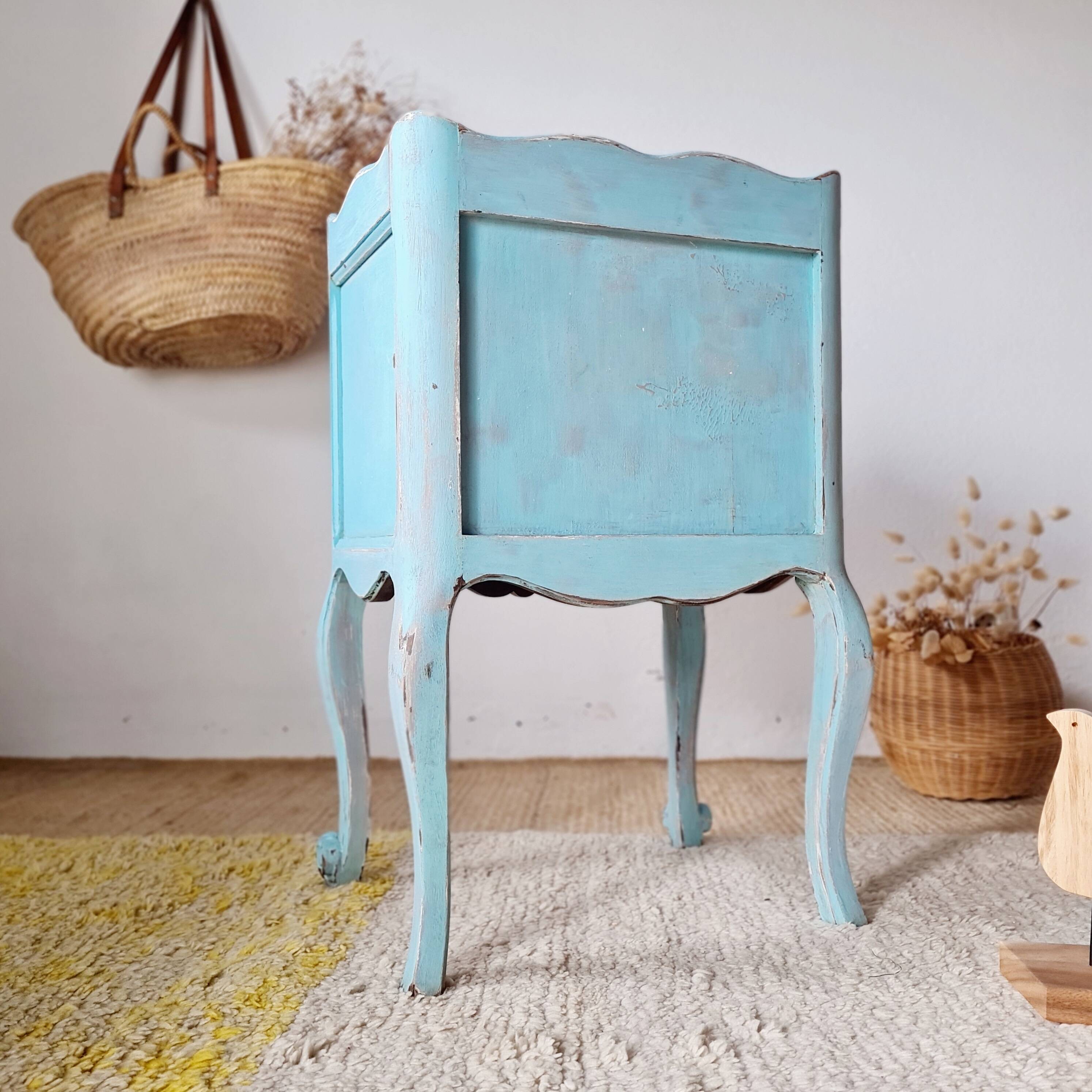 Small vintage bedside table in azure blue patina.