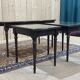 English nesting tables in mahogany and leather top under glass - work from the 1950s