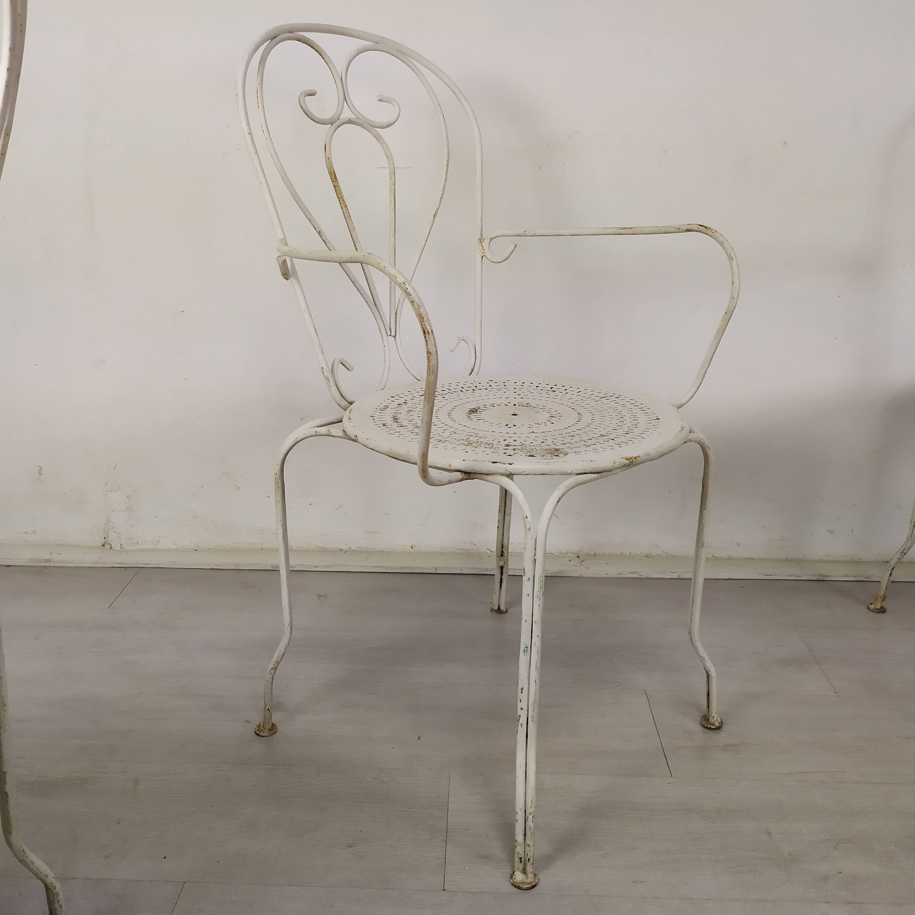 4 wrought iron garden armchairs