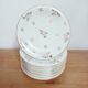 Set of 9 flat plates in Limoges porcelain, white and gold