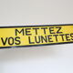Warning industrial plate "put your glasses"