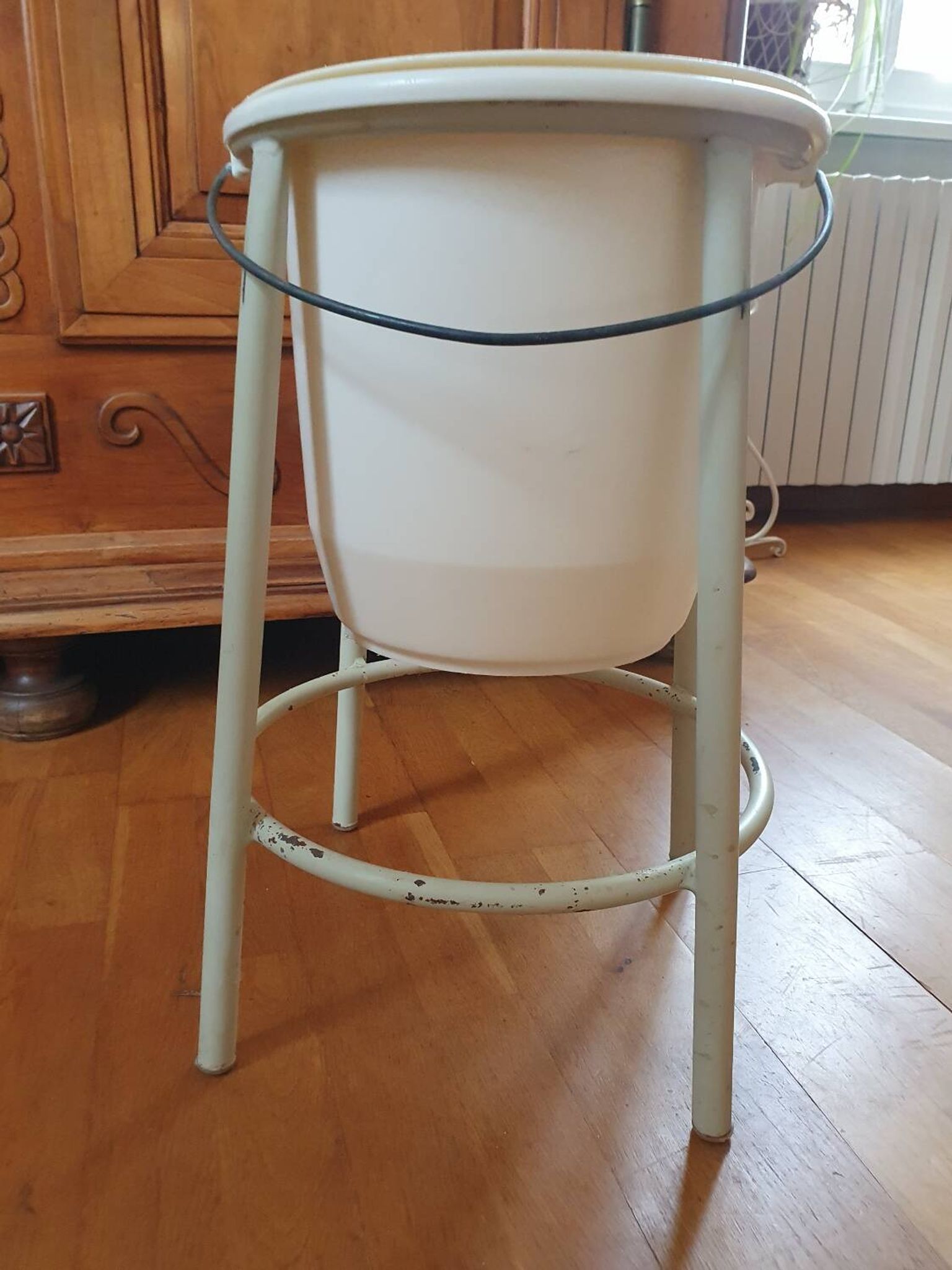 Trash can on vintage industrial style metal base