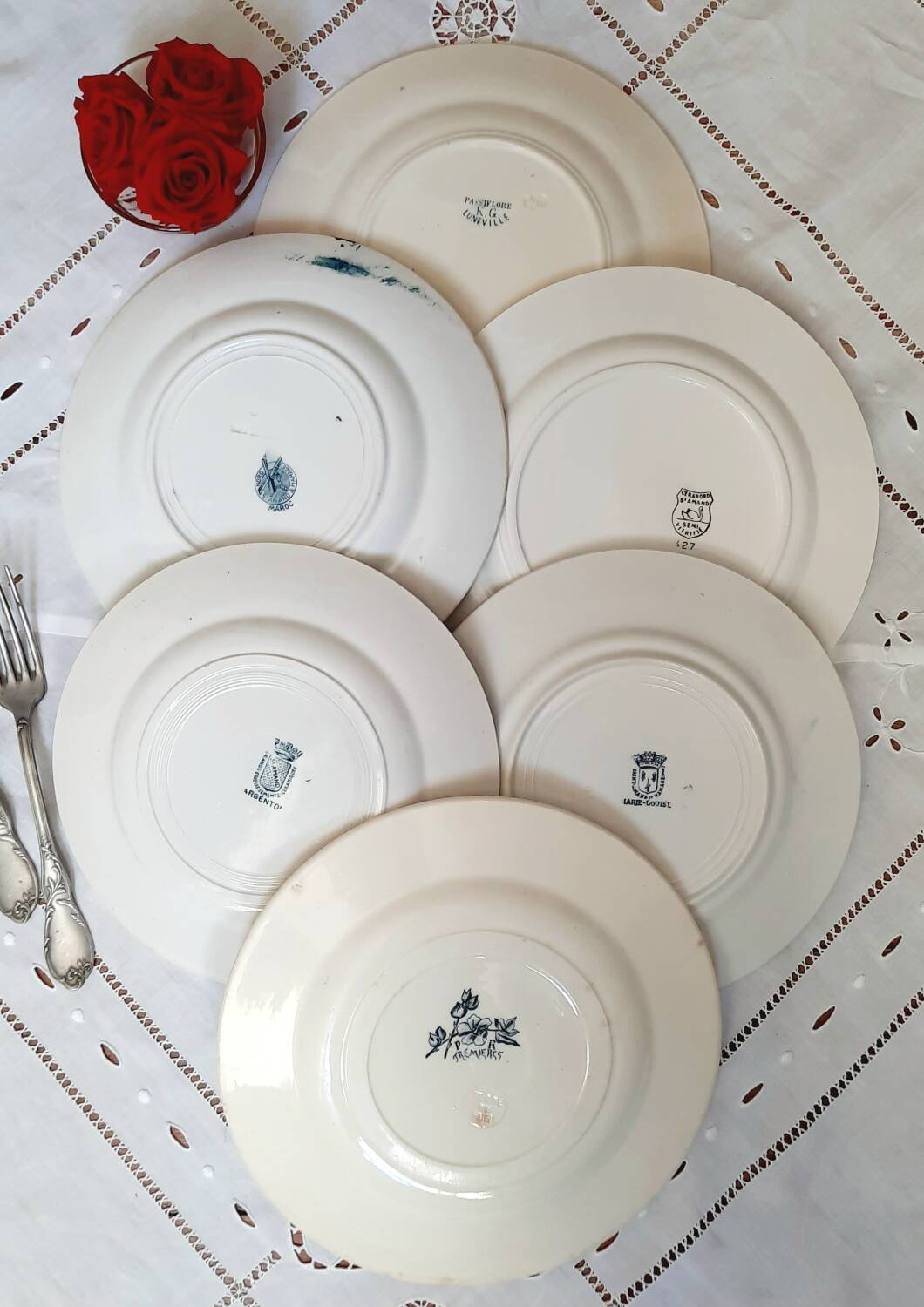 Old mismatched dinner plates accompanied by a dish