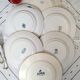 Old mismatched dinner plates accompanied by a dish