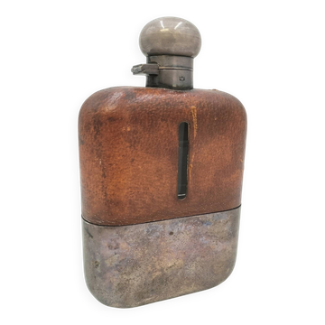 Silver-plated metal flask with leather and glass