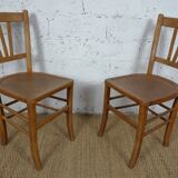 oak tray table with cast iron legs and pair of bistro chairs